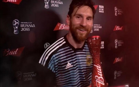 Messi holding trophy